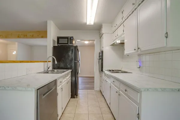 a view of storage and utility room with empty racks