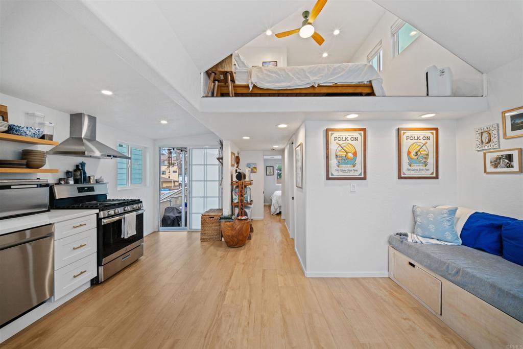 1624 North Coast Highway 101, Unit 45 Encinitas, CA 92024 - Photo 12 of 37 a kitchen with stainless steel appliances granite countertop a stove a sink dishwasher and a refrigerator