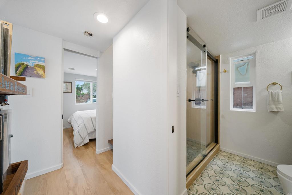 1624 North Coast Highway 101, Unit 45 Encinitas, CA 92024 - Photo 16 of 37 a view of a bedroom from a hallway