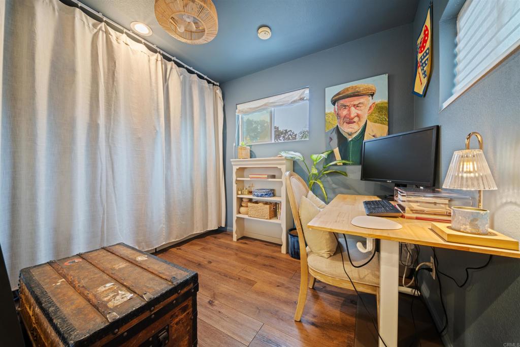 1624 North Coast Highway 101, Unit 45 Encinitas, CA 92024 - Photo 24 of 37 a view of a workspace with furniture and a window
