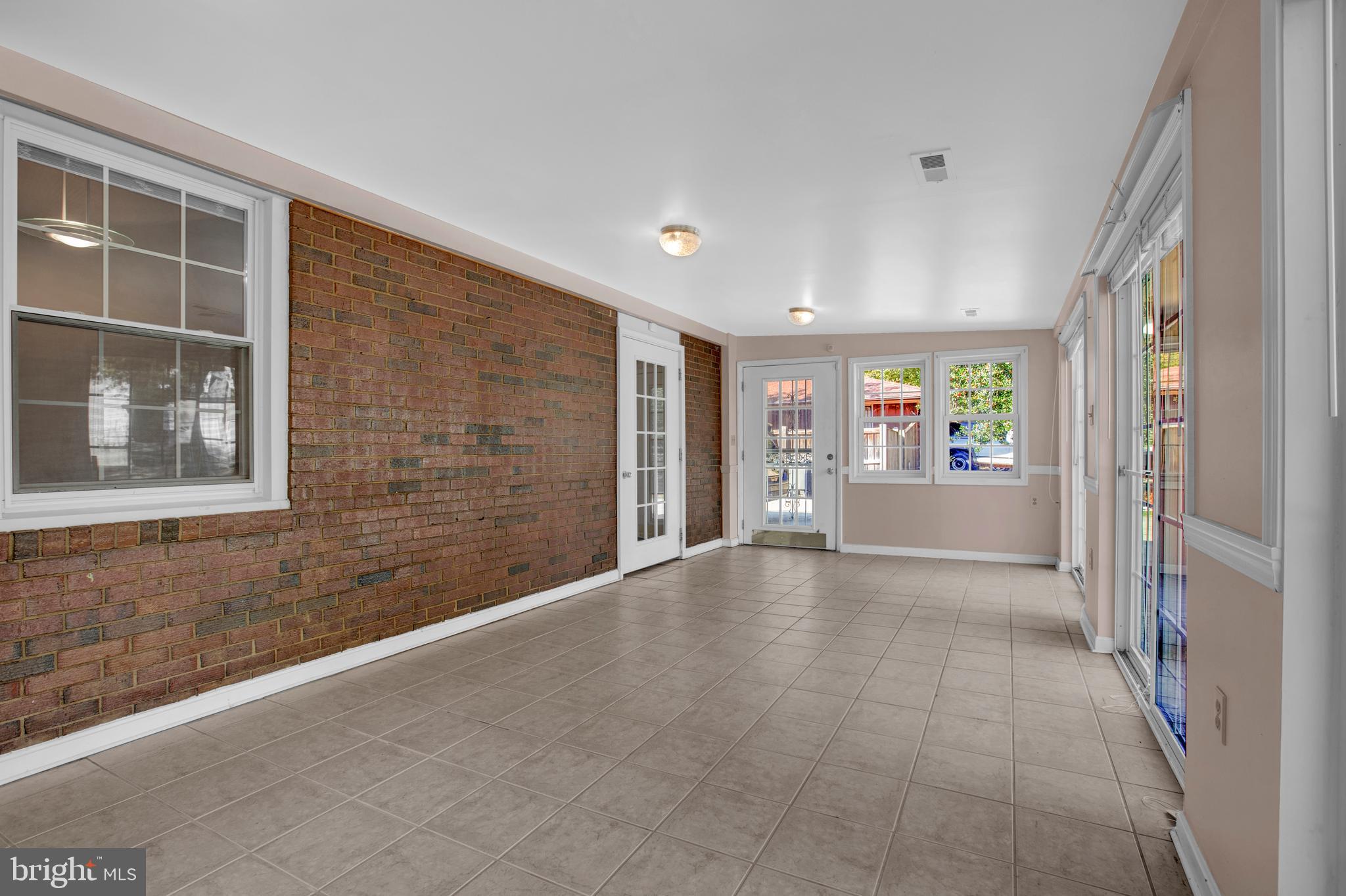 6811 Coolridge Road Temple Hills, MD 20748 - Photo 18 of 56 Bright Enclosed Porch w/3 sets of sliders
