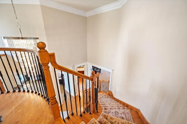 a view of staircase with wooden floor
