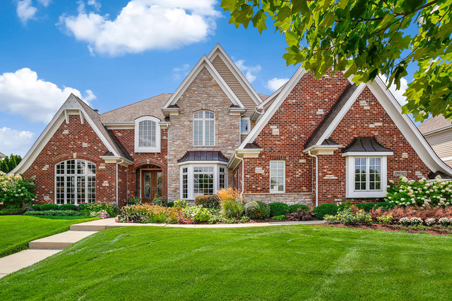 39W821 South Hathaway Lane Geneva, IL 60134 - Photo 2 of 54 a front view of a house with a yard