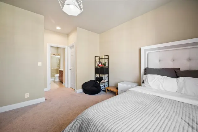 a bedroom with a bed and cabinets