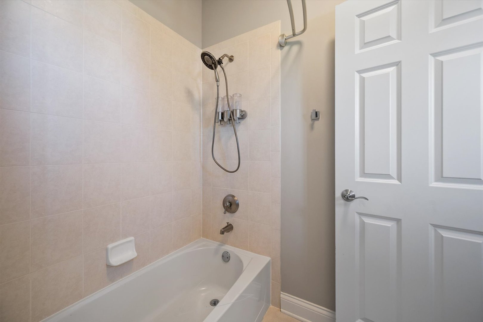39W821 South Hathaway Lane Geneva, IL 60134 - Photo 30 of 54 a bathroom with a bath tub with a shower