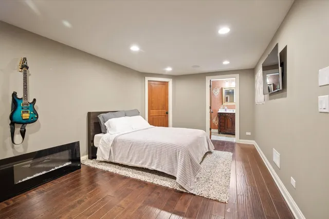 a spacious bedroom with a bed and a window