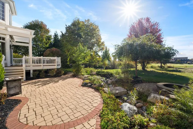 a view of a backyard with sitting area