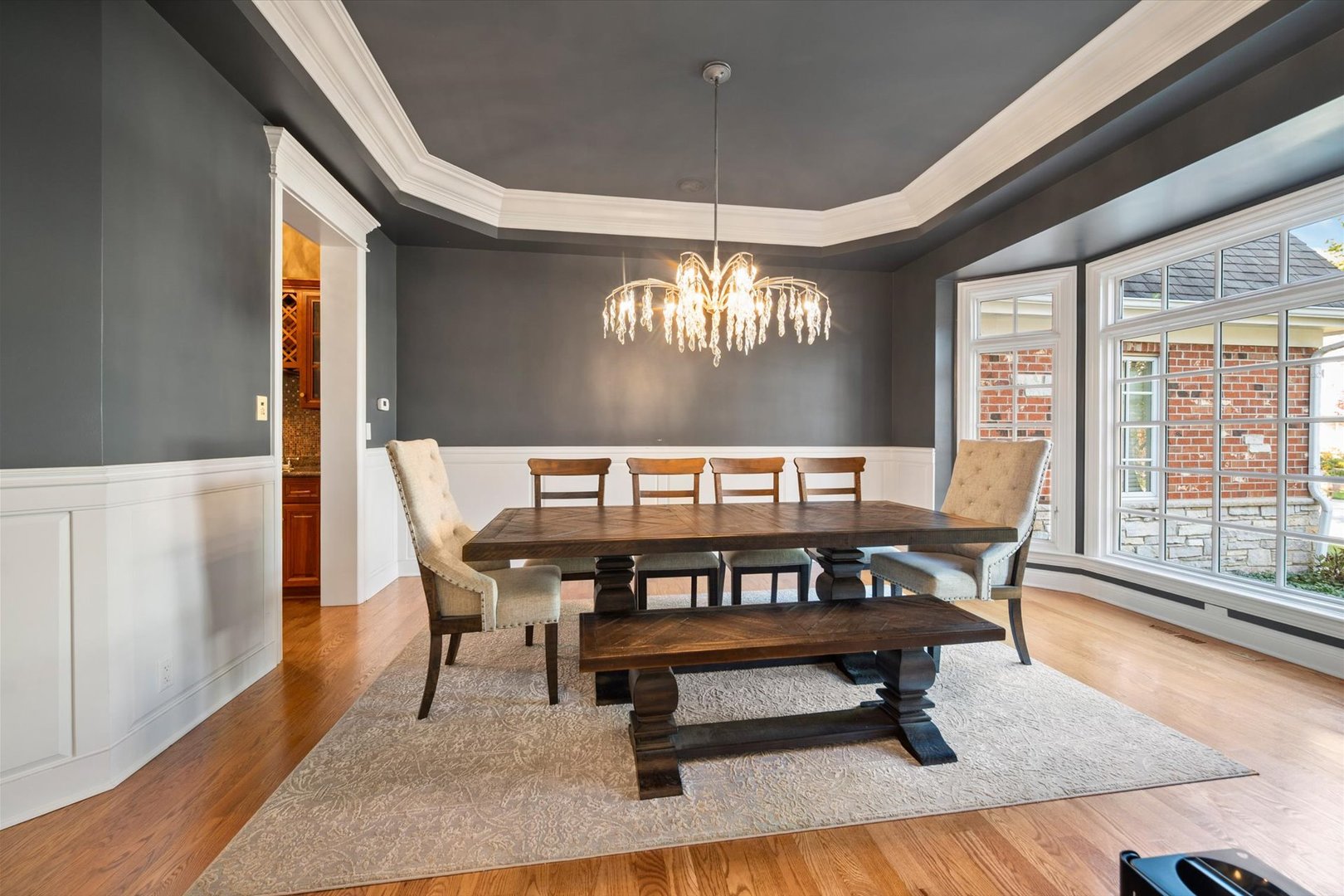 39W821 South Hathaway Lane Geneva, IL 60134 - Photo 7 of 54 a view of a dining room with furniture a chandelier and wooden floor