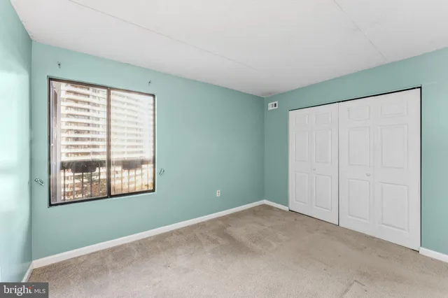 a bathroom with a granite countertop sink a mirror a toilet and bathtub