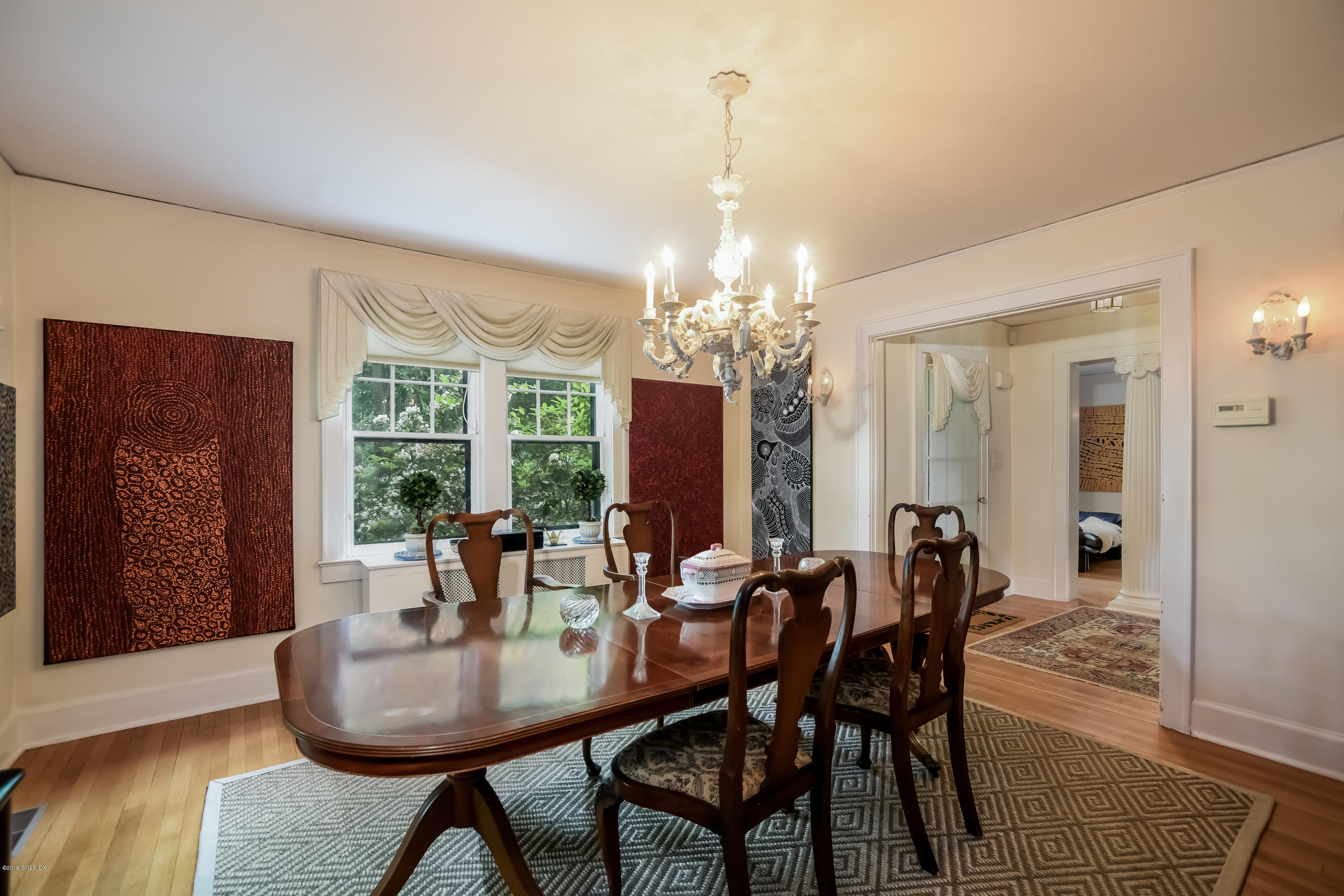 12 Old Post Road Cos Cob, CT 06830 - Photo 11 of 34 a view of a dining room with furniture and chandelier