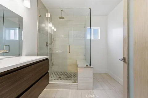 a bathroom with a shower and a sink