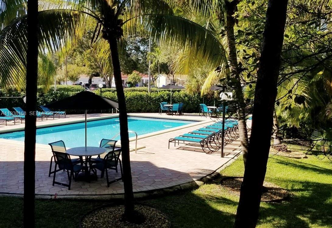 2160 Southwest 16th Avenue, Unit 314 Miami, FL 33145 - Photo 14 of 15 a view of a swimming pool with a patio