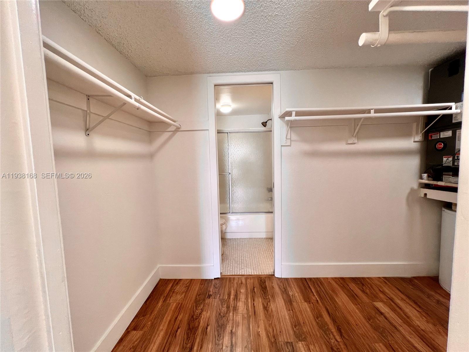 2160 Southwest 16th Avenue, Unit 314 Miami, FL 33145 - Photo 10 of 15 a view of walk in closet with wooden floor