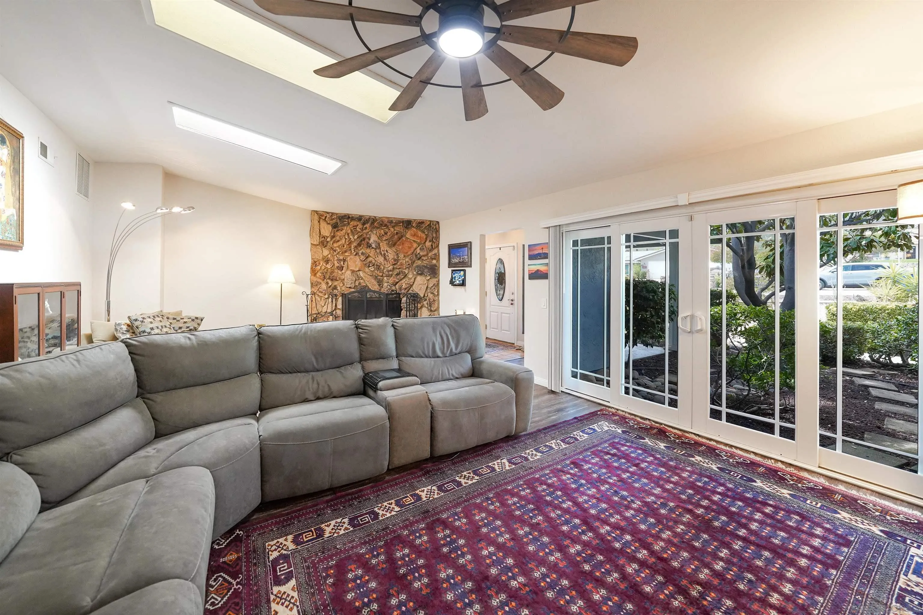 24563 Del Amo Road Ramona, CA 92065 - Photo 16 of 59 a living room with furniture and a floor to ceiling window