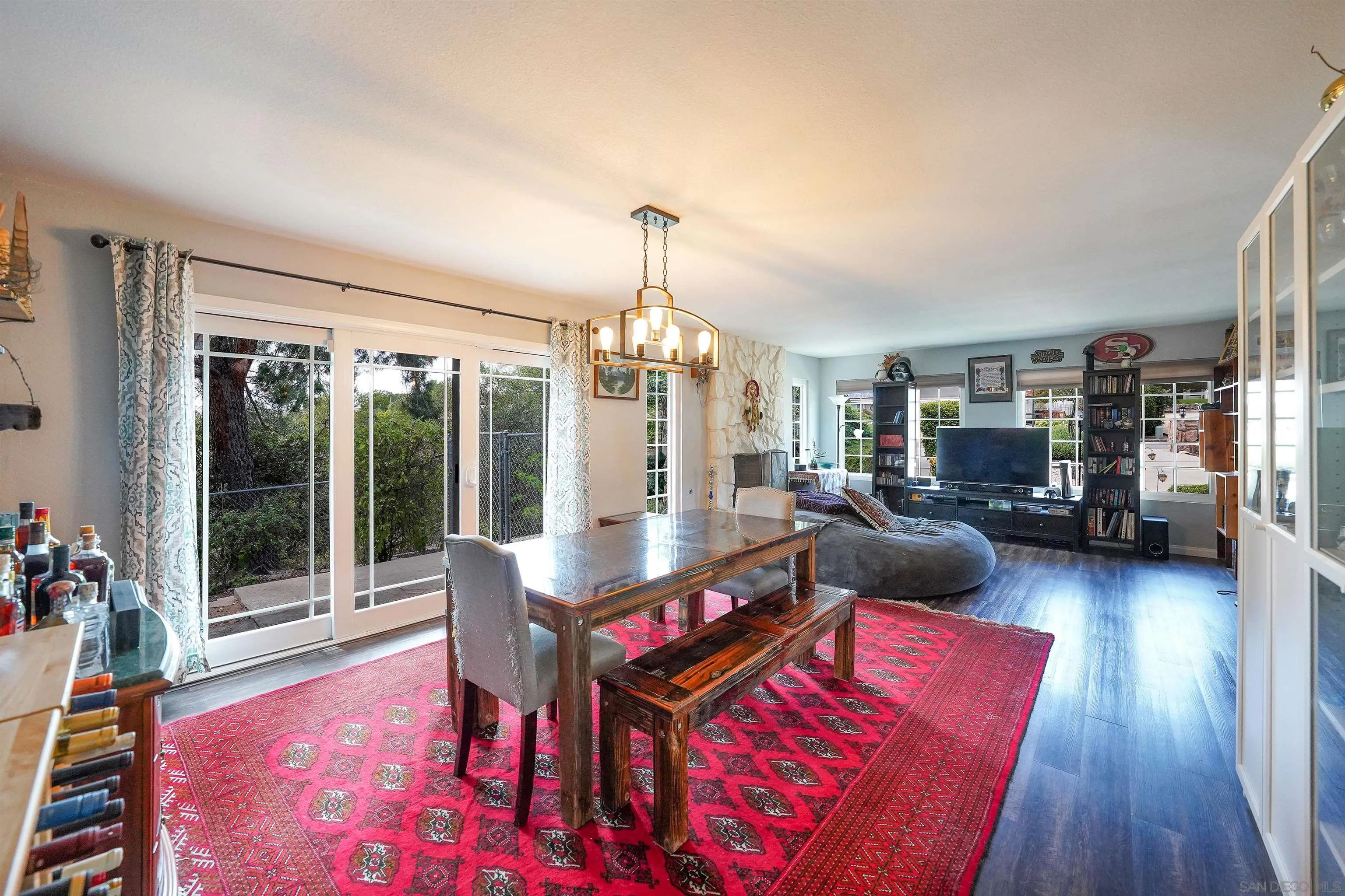 24563 Del Amo Road Ramona, CA 92065 - Photo 21 of 59 a living room with furniture and a chandelier
