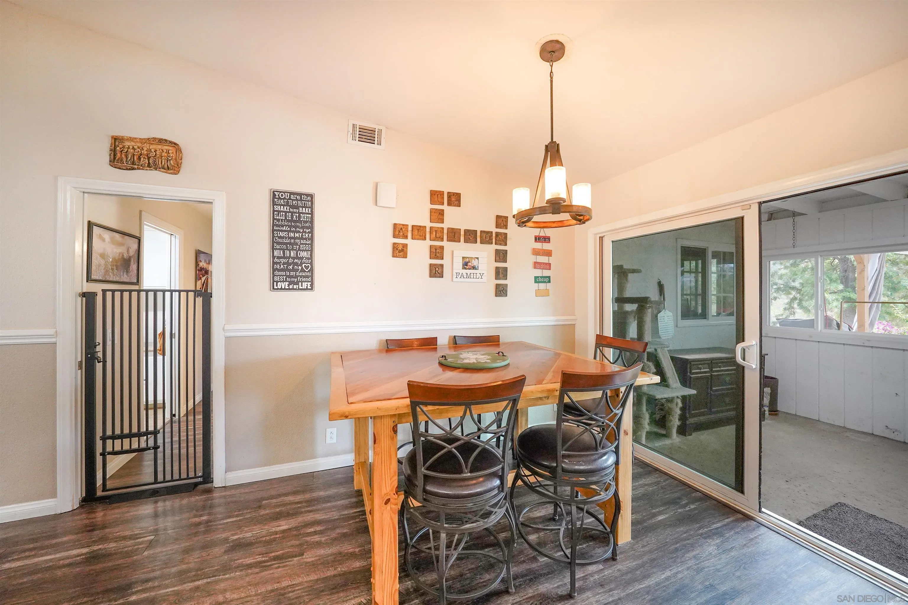 24563 Del Amo Road Ramona, CA 92065 - Photo 22 of 59 a dining room with furniture and wooden floor