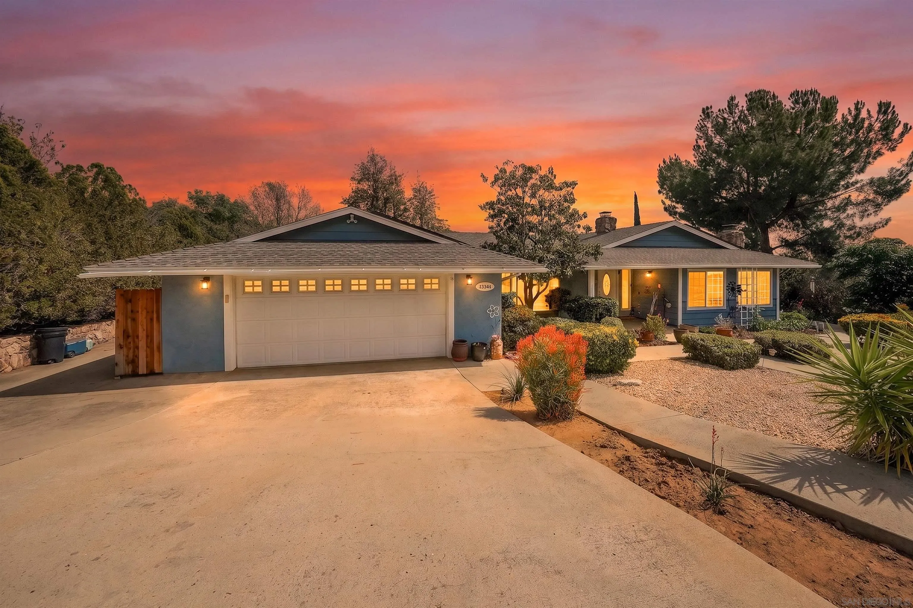 24563 Del Amo Road Ramona, CA 92065 - Photo 3 of 59 a front view of a house with a yard and balcony