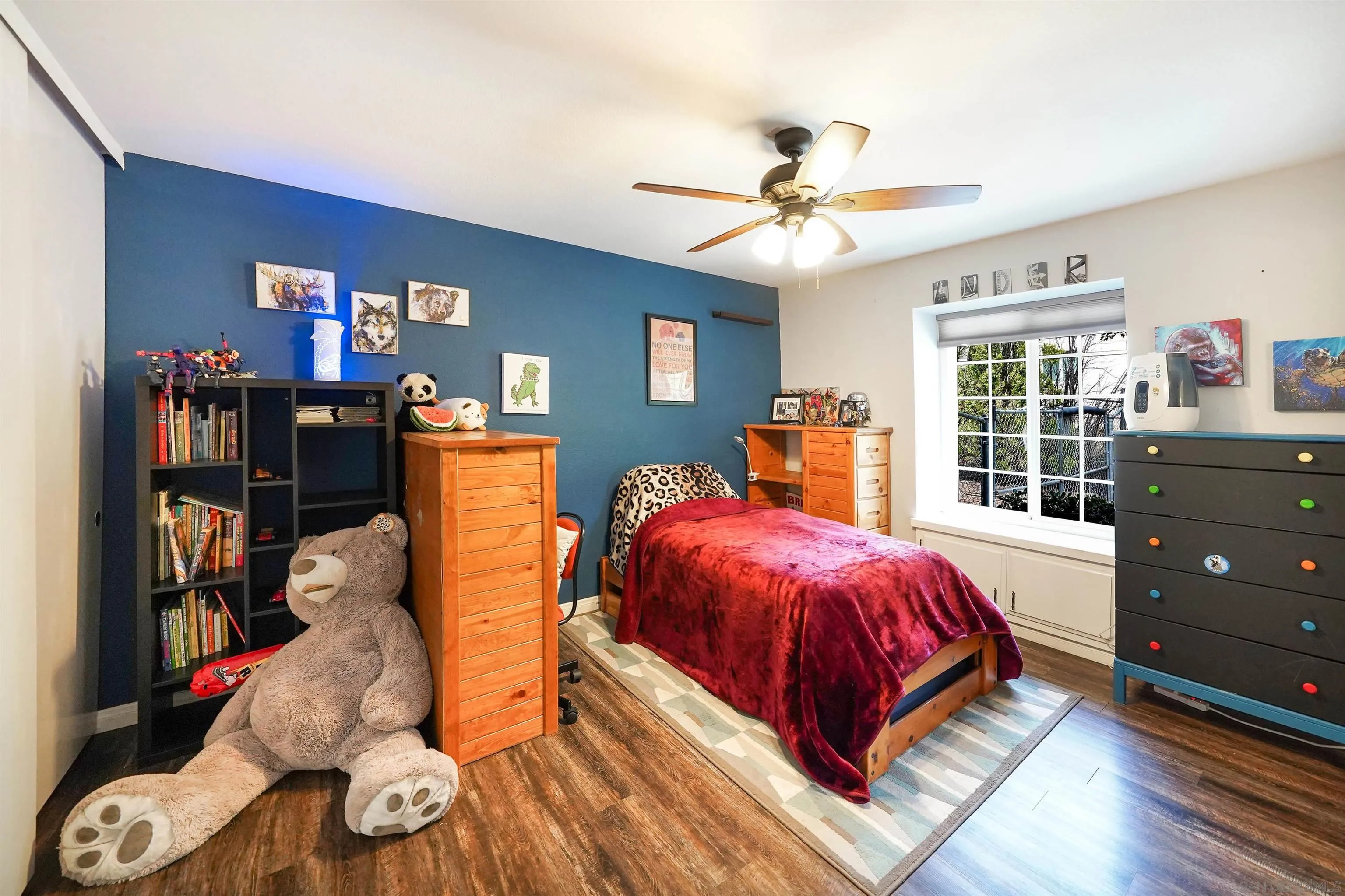 24563 Del Amo Road Ramona, CA 92065 - Photo 32 of 59 a bedroom with bed and wooden floor