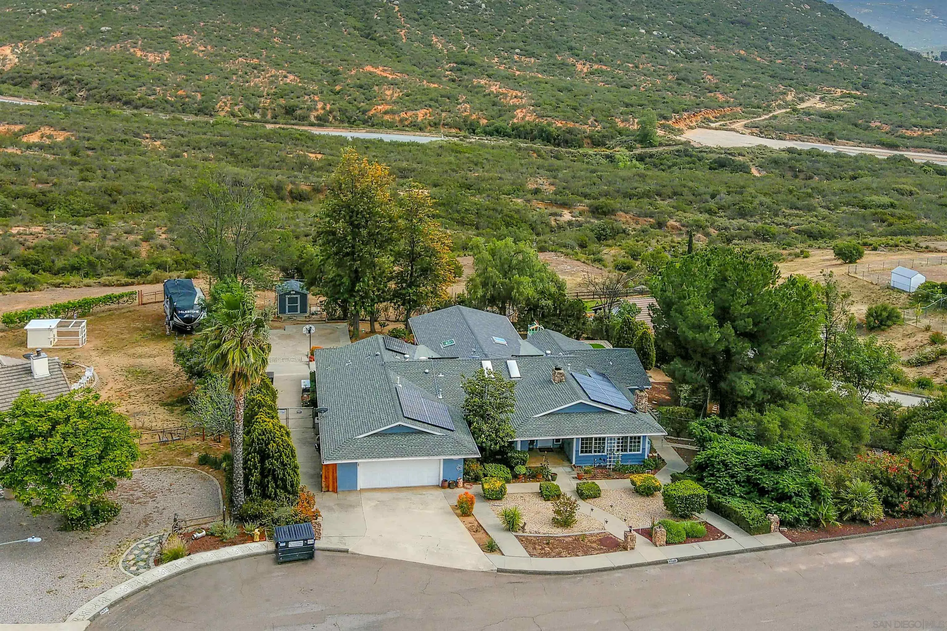 24563 Del Amo Road Ramona, CA 92065 - Photo 39 of 59 an aerial view of residential houses with outdoor space and parking