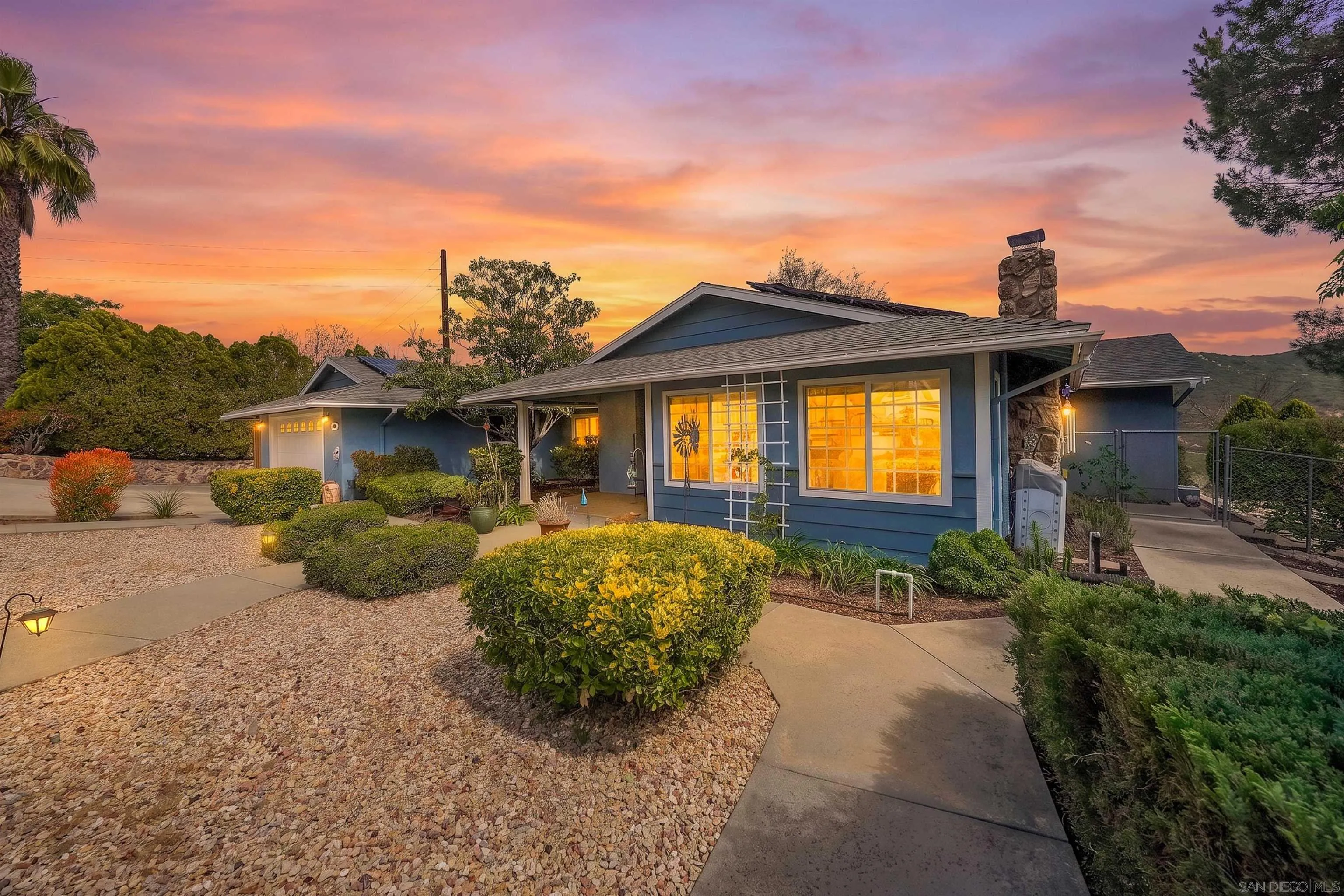 24563 Del Amo Road Ramona, CA 92065 - Photo 4 of 59 a front view of a house with garden