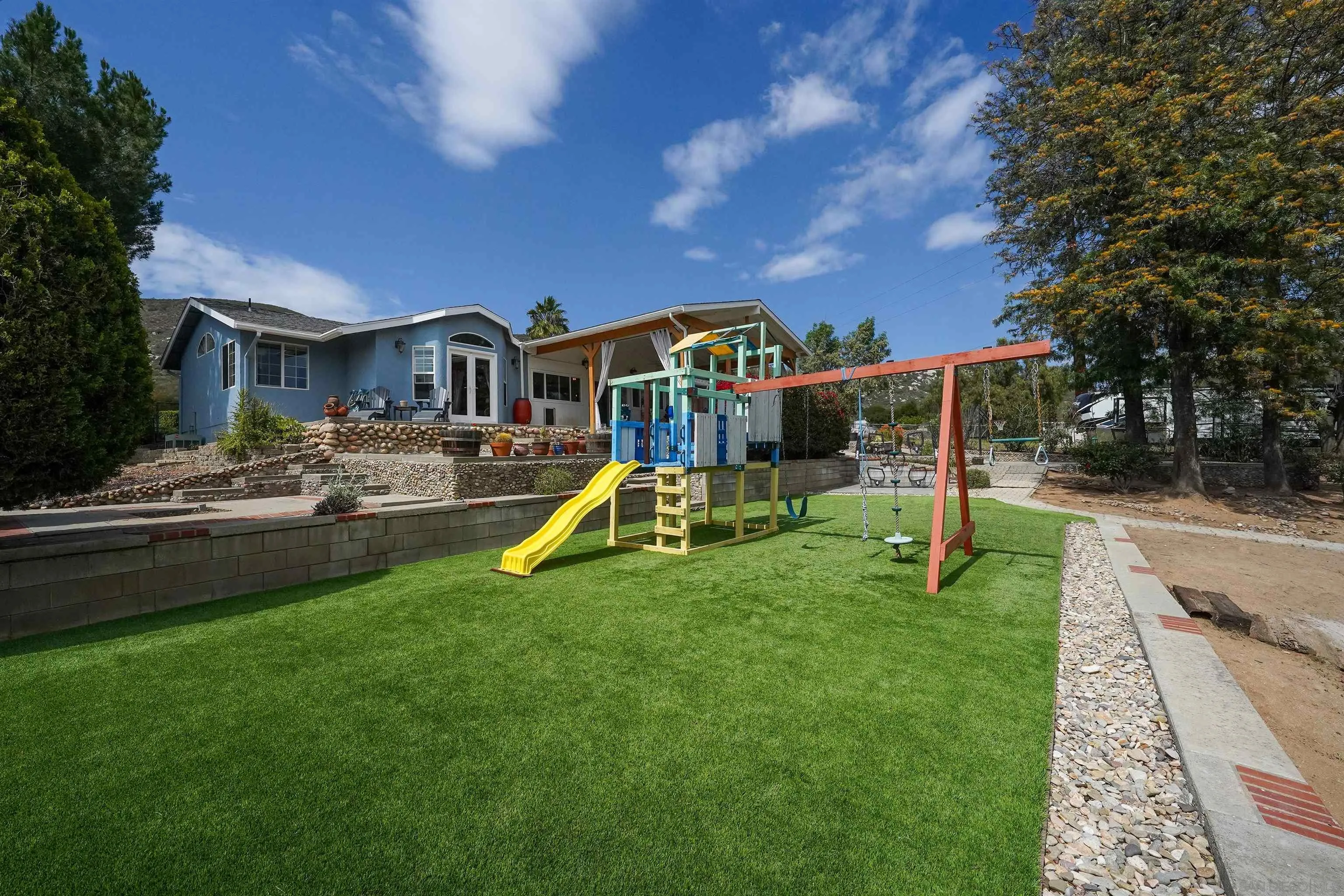 24563 Del Amo Road Ramona, CA 92065 - Photo 56 of 59 a view of a house with swimming pool and a yard