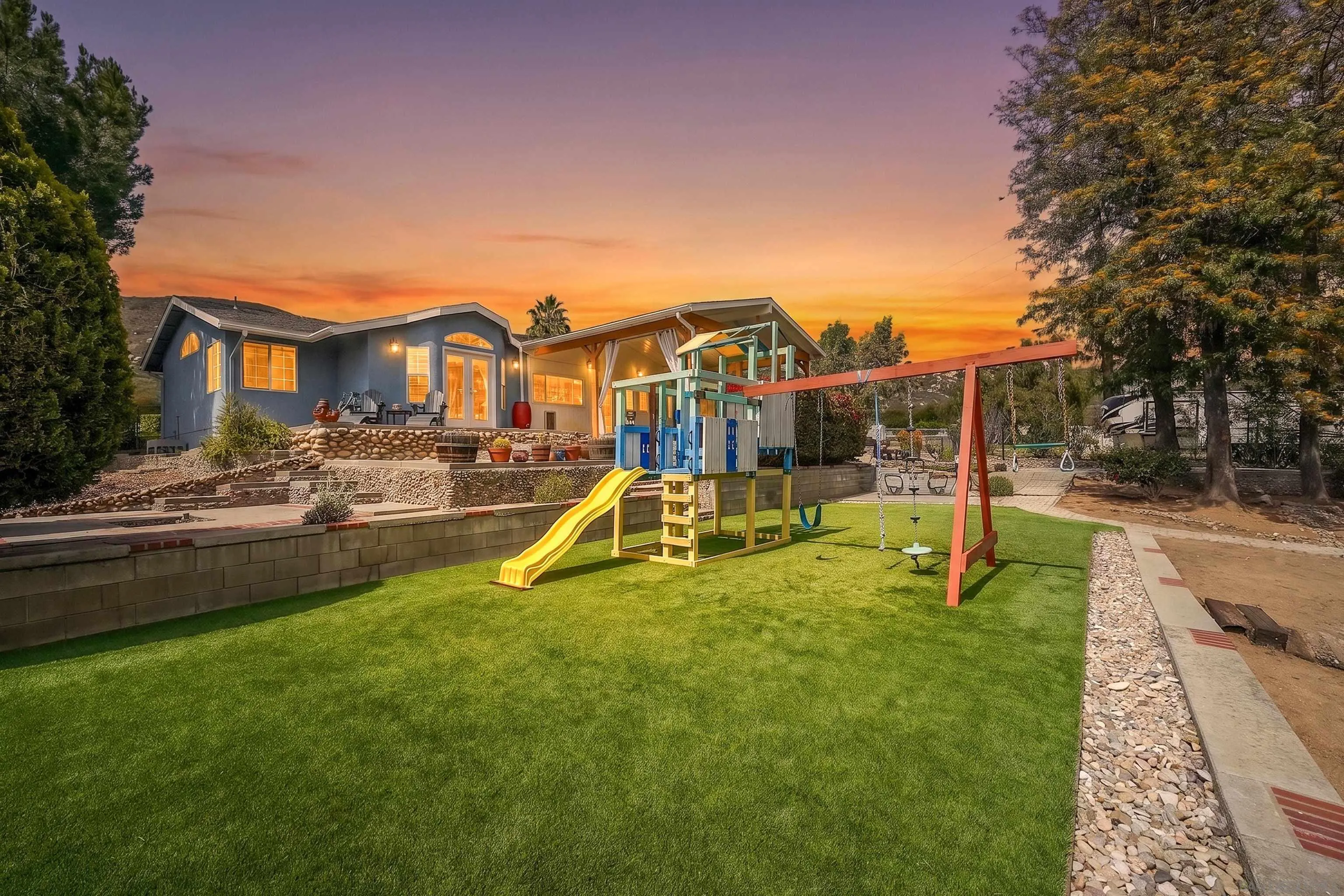 24563 Del Amo Road Ramona, CA 92065 - Photo 9 of 59 a view of a white house with a swimming pool and a yard