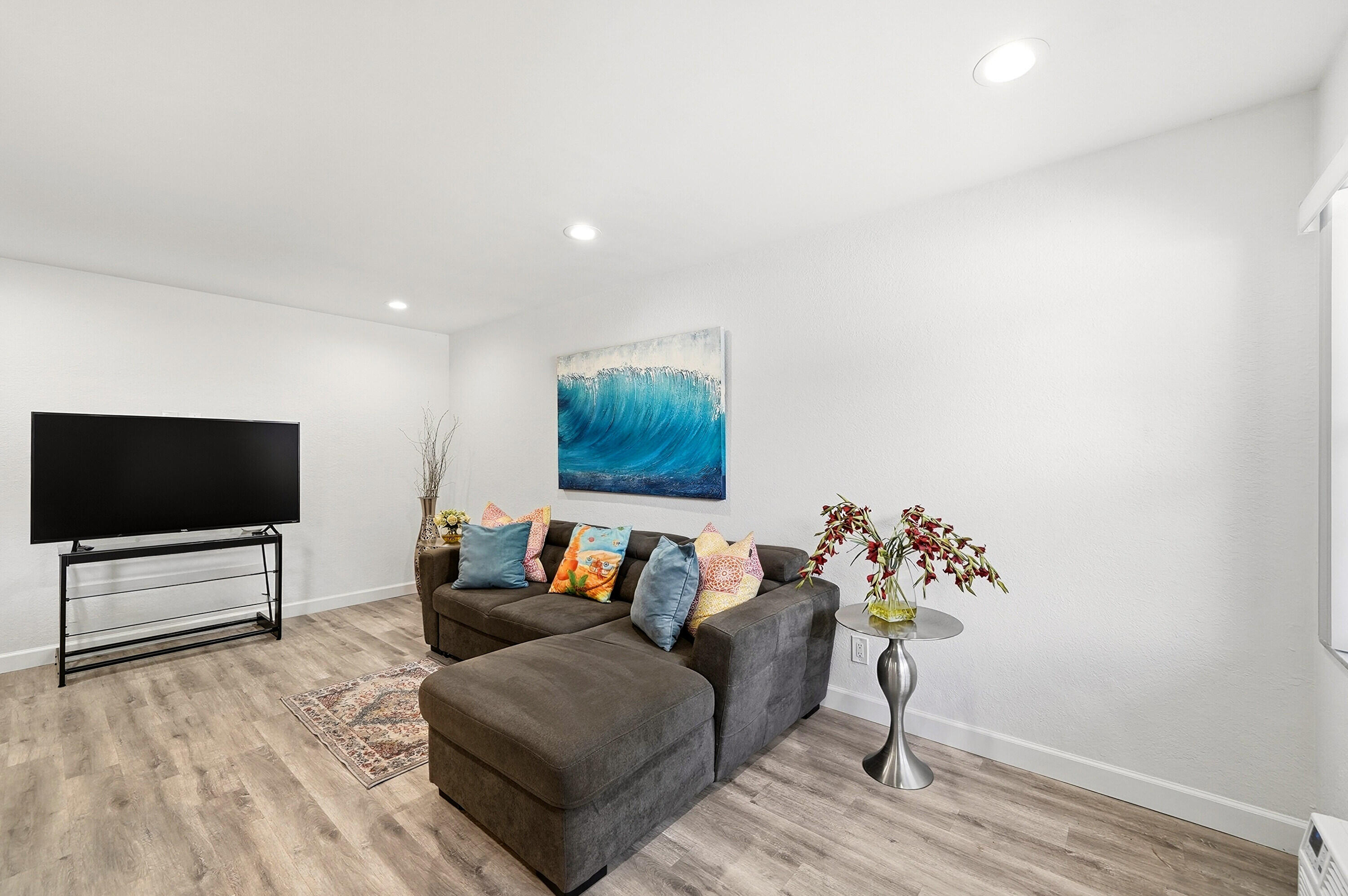 3510 Harrison Street, Unit 4 Hollywood, FL 33021 - Photo 10 of 31 a living room with furniture and a flat screen tv
