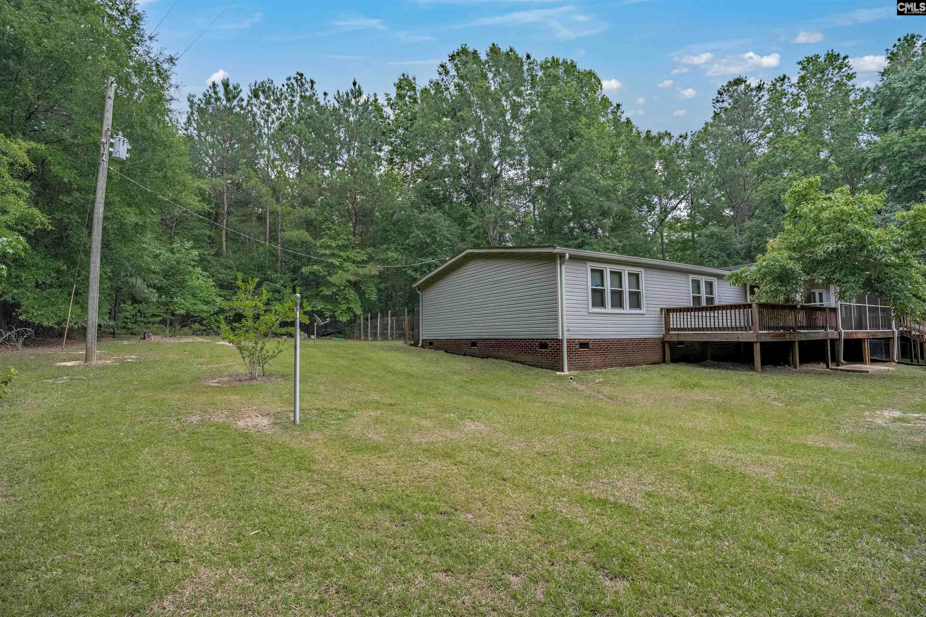 304 Cooper Road Blythewood, SC 29016 - Photo 27 of 29 a house view with a play ground in front of it