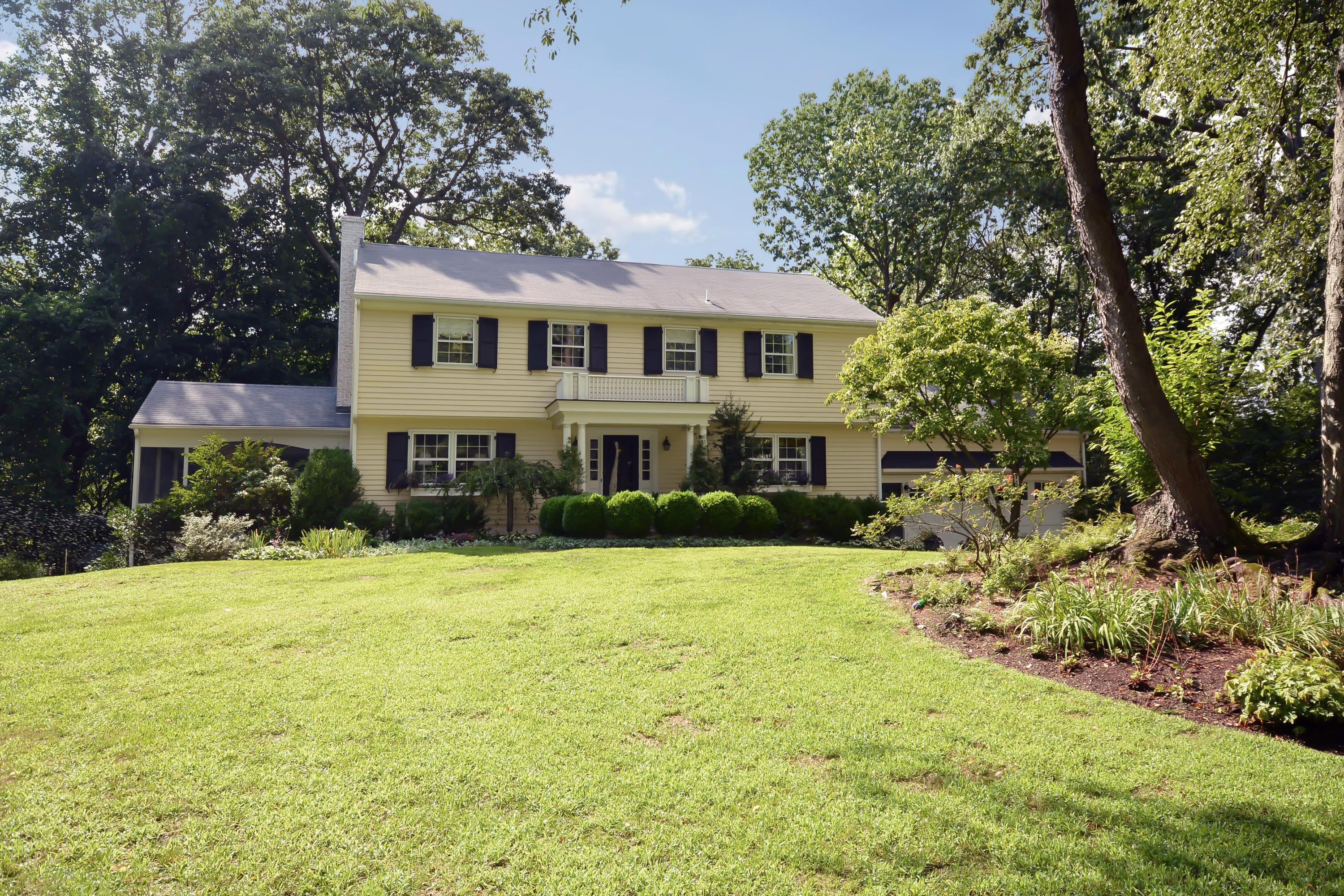 47 Delafield Island Road Darien, CT 06820 - Photo 1 of 26 a front view of a house with a yard and garage