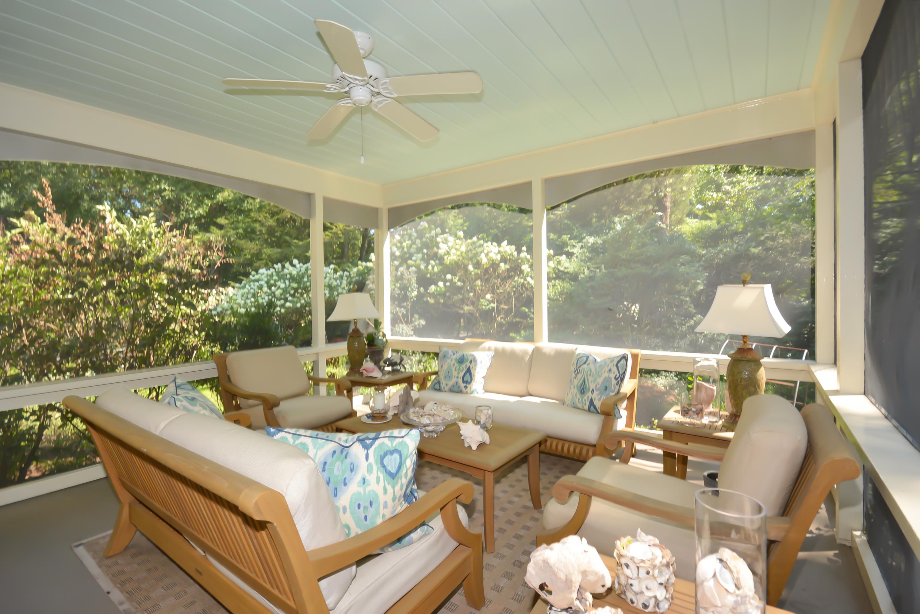 47 Delafield Island Road Darien, CT 06820 - Photo 14 of 26 a living room with furniture and a large window