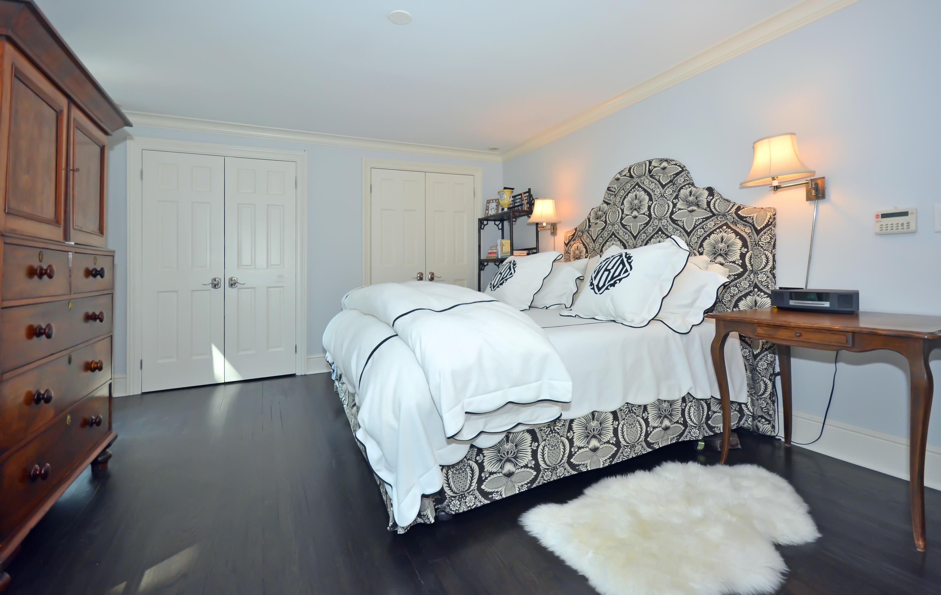 47 Delafield Island Road Darien, CT 06820 - Photo 16 of 26 a bedroom with a bed and a window