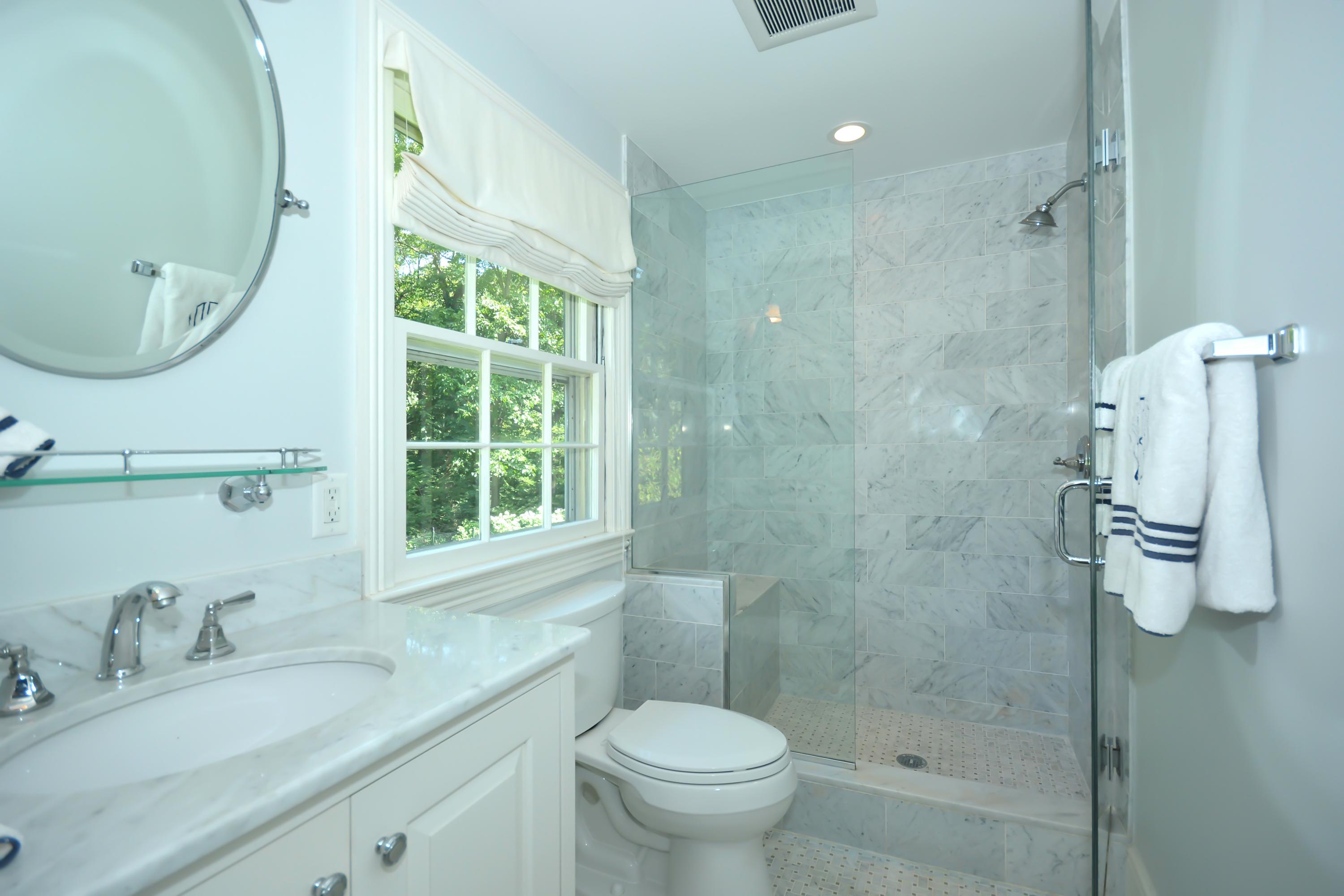 47 Delafield Island Road Darien, CT 06820 - Photo 19 of 26 a bathroom with a granite countertop sink toilet and shower