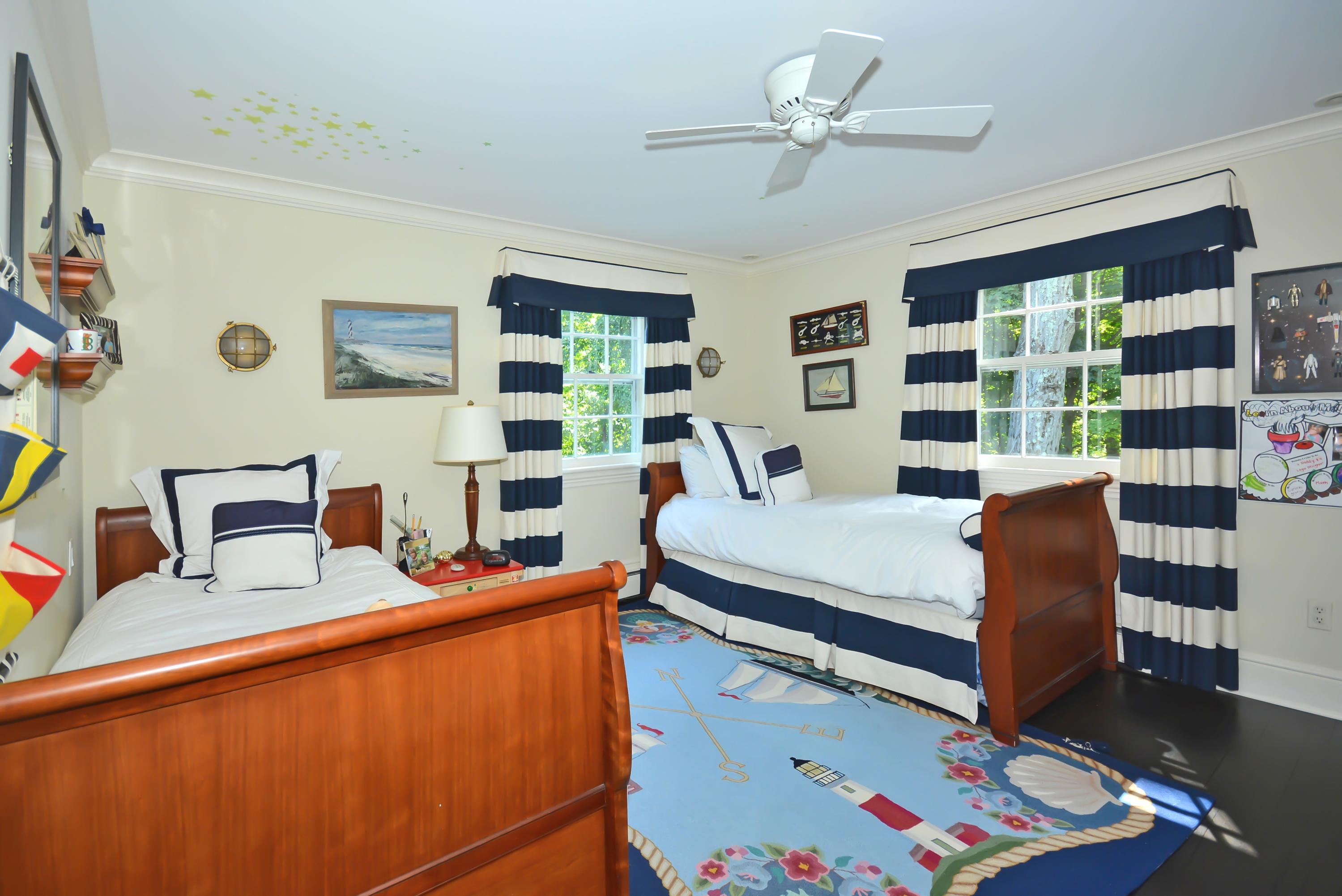 47 Delafield Island Road Darien, CT 06820 - Photo 20 of 26 a bedroom with a bed furniture and a large window