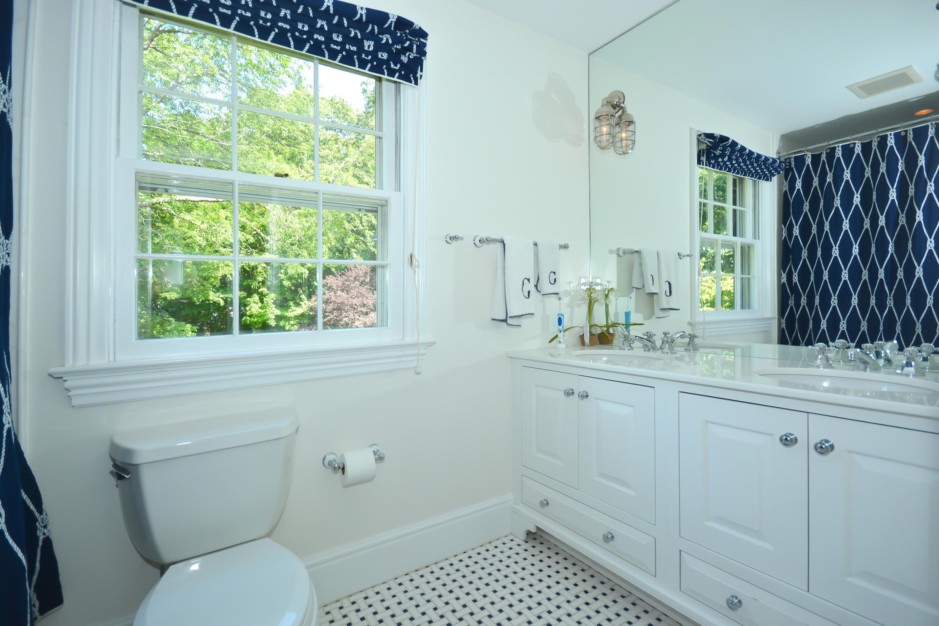 47 Delafield Island Road Darien, CT 06820 - Photo 21 of 26 a bathroom with a sink toilet and window