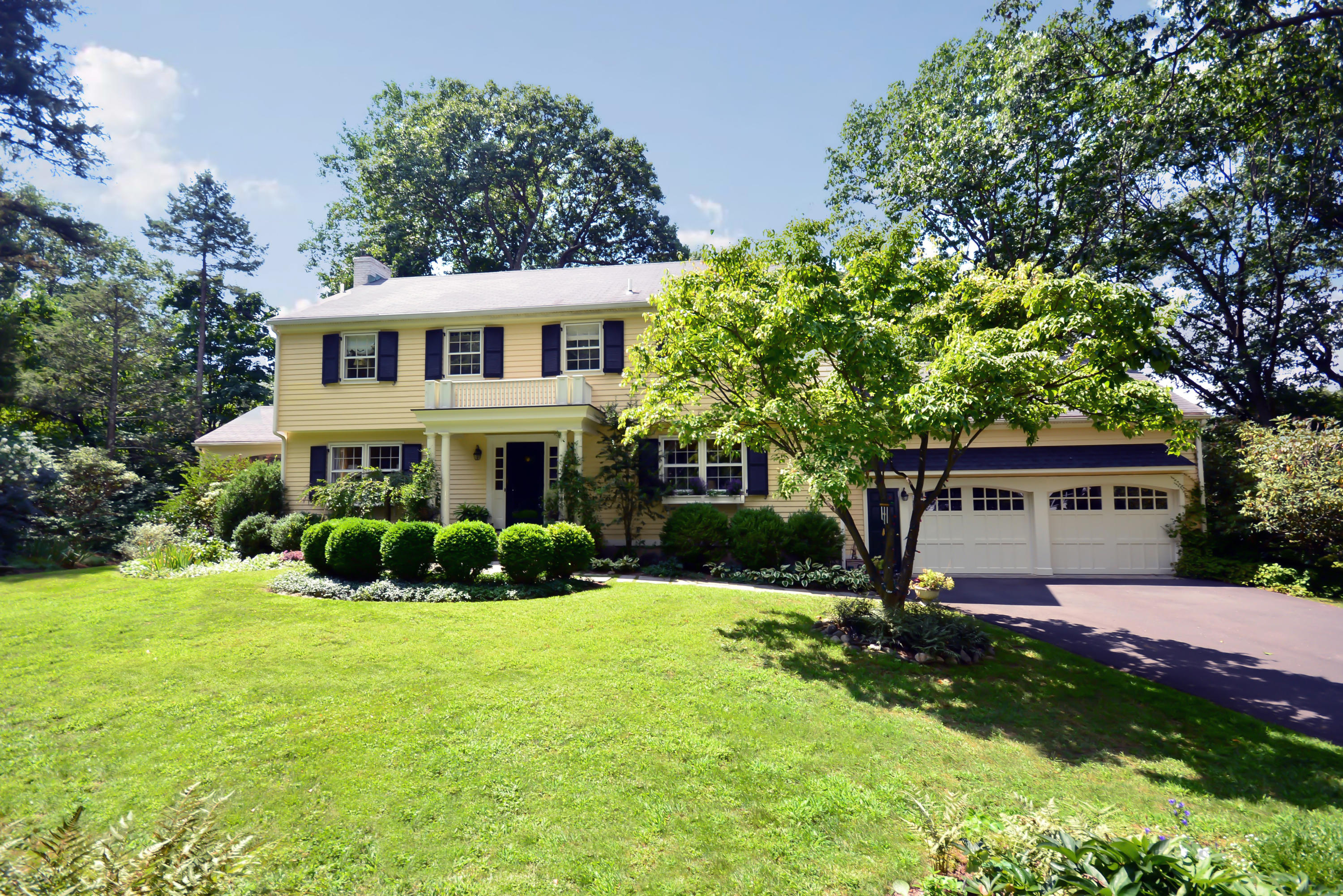 47 Delafield Island Road Darien, CT 06820 - Photo 25 of 26 a front view of a house with a yard table and chairs