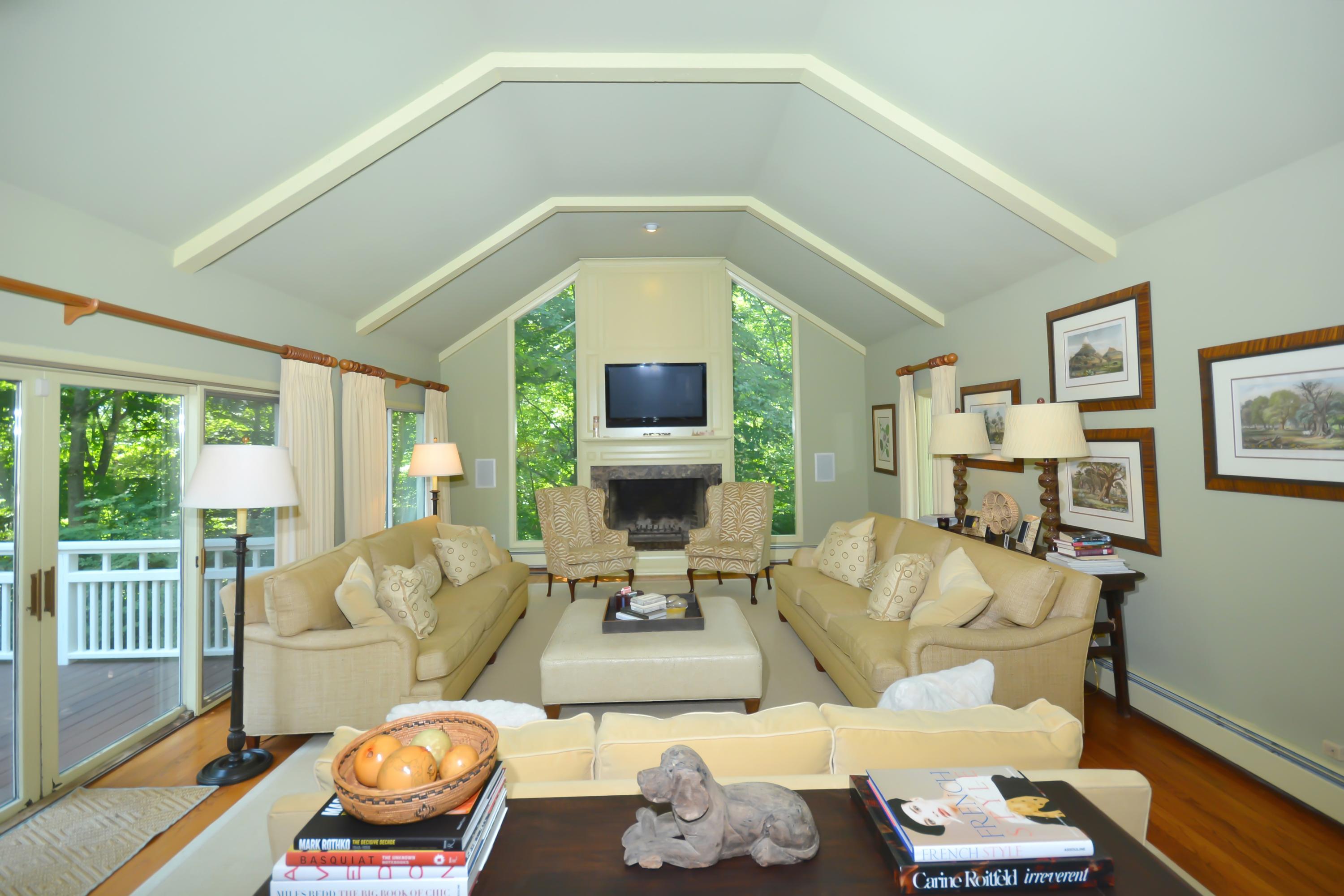47 Delafield Island Road Darien, CT 06820 - Photo 8 of 26 a living room with furniture and a large window