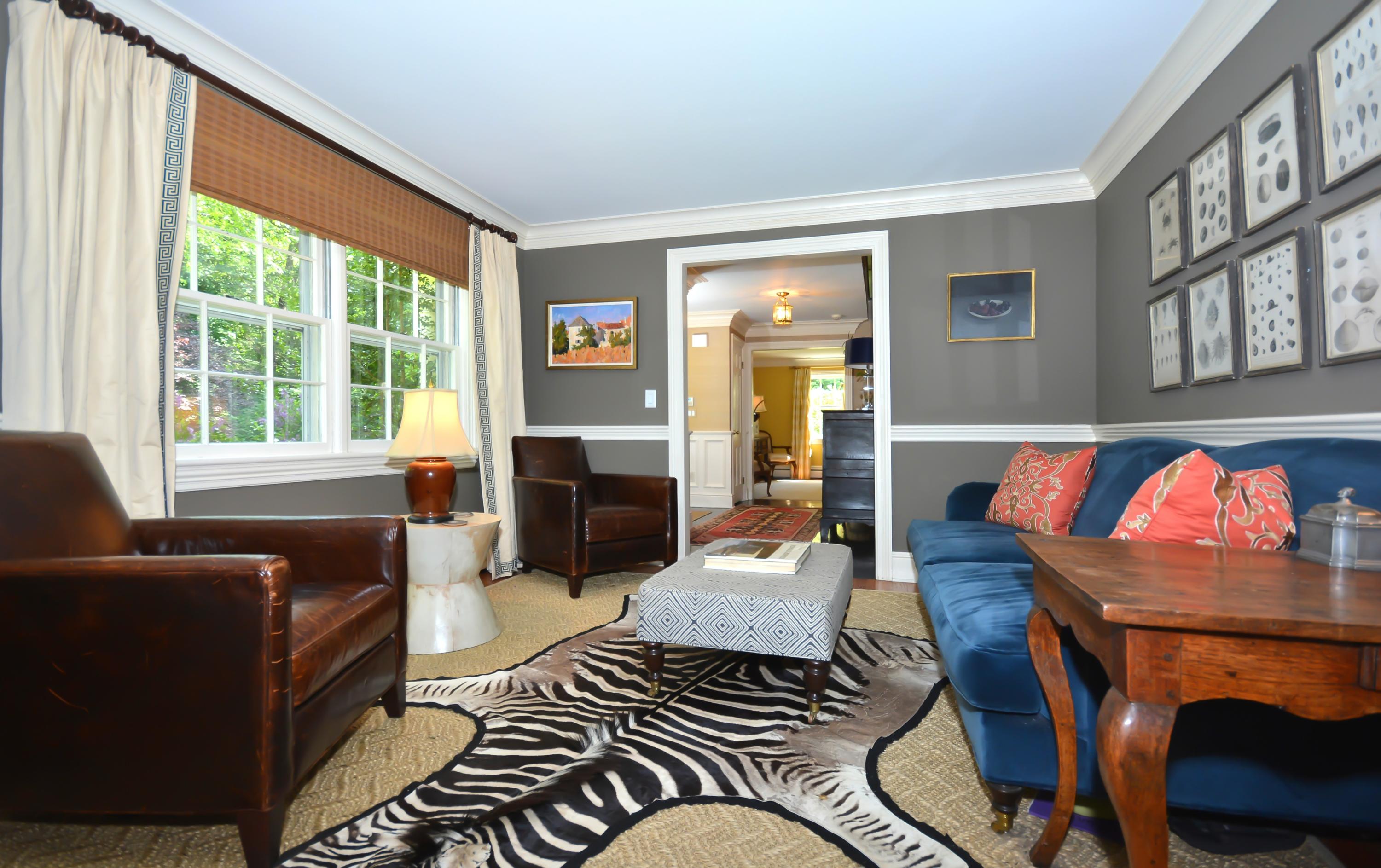 47 Delafield Island Road Darien, CT 06820 - Photo 9 of 26 a living room with fireplace furniture and a floor to ceiling window