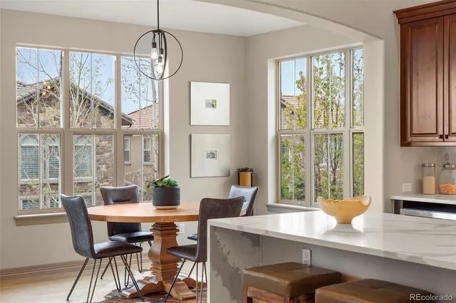 a view of a dining room with furniture window and outside view