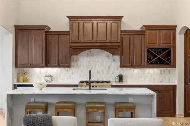 a kitchen with a sink cabinets and window