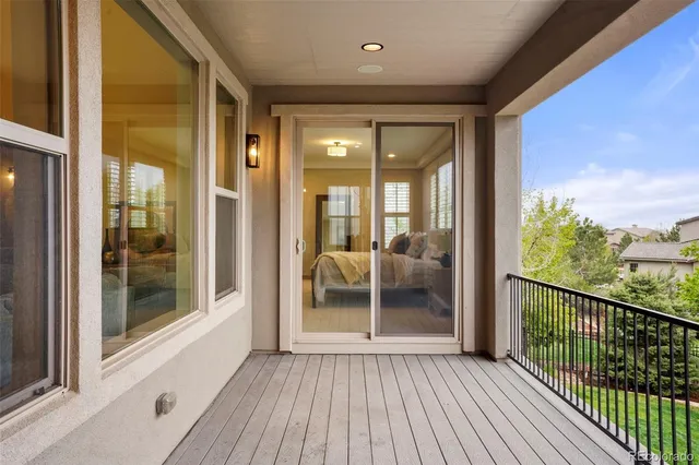 a view of a balcony with wooden floor and wooden floor