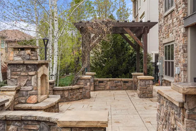 a view of a patio with table and chairs and potted plants