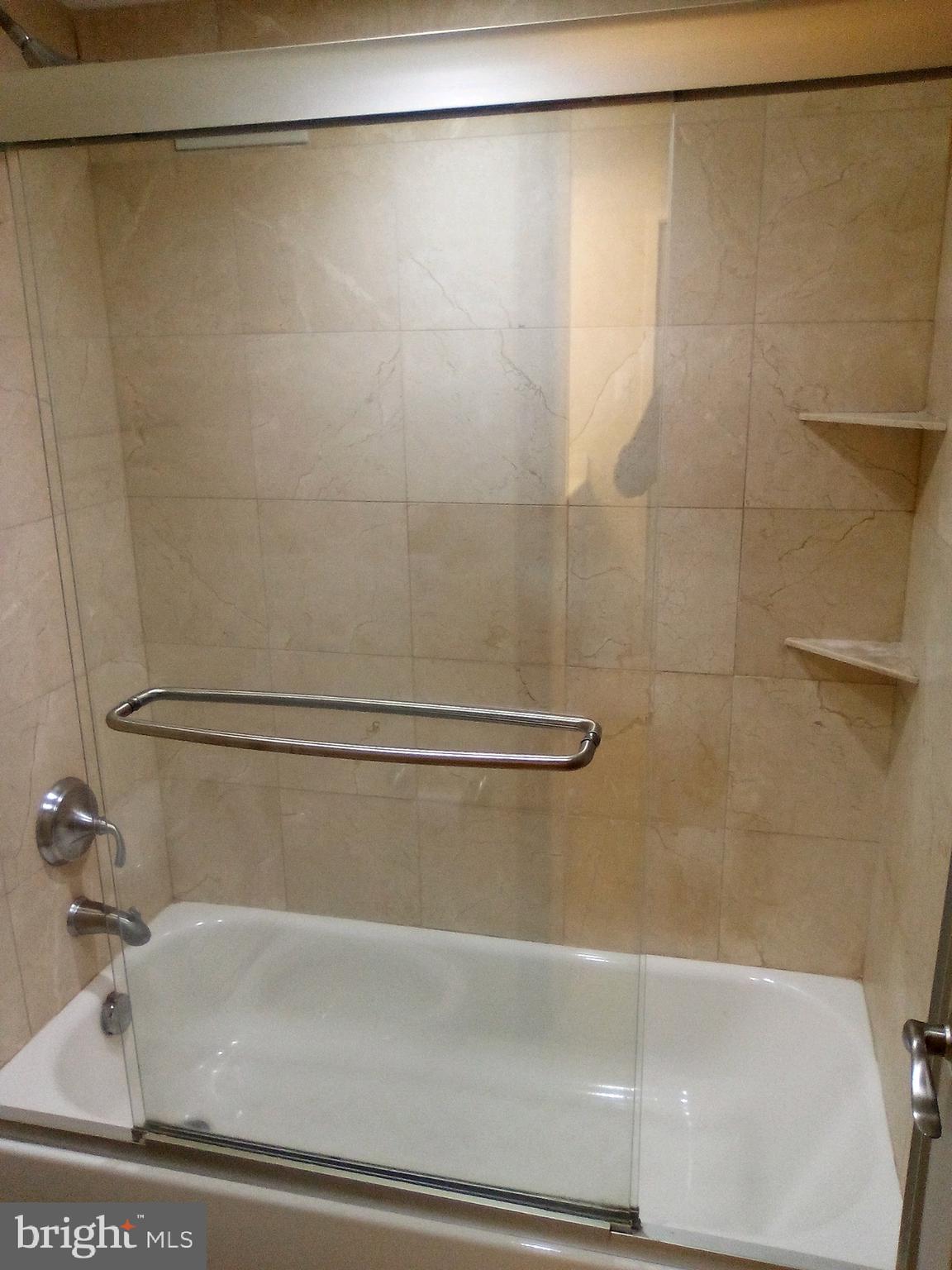 7333 New Hampshire Avenue, Unit 1107 Takoma Park, MD 20912 - Photo 19 of 25 a bathroom with a shower