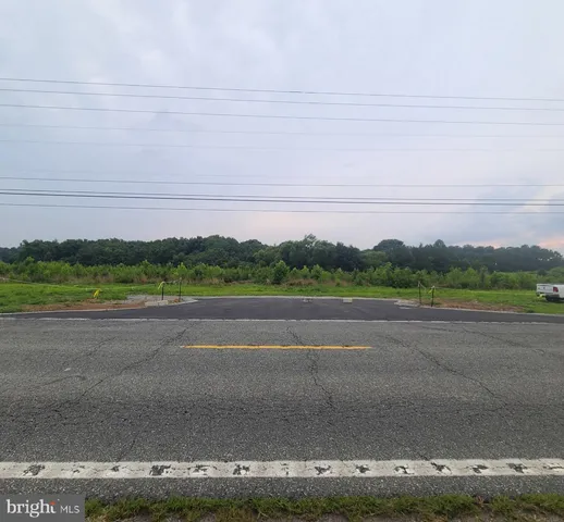 a view of a road and a field