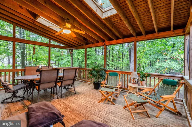 a house with lots of trees in front of it