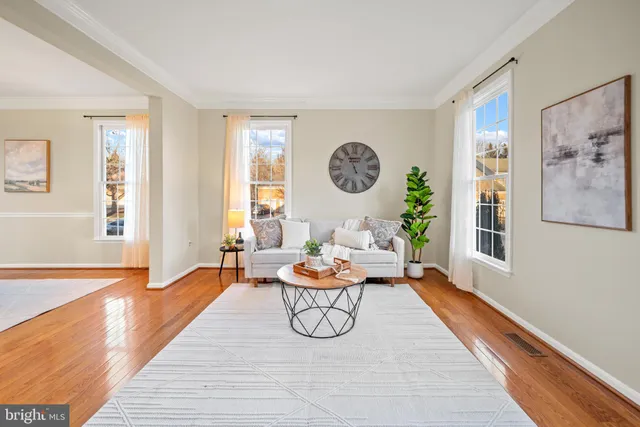 a view of a patio with table and chairs and potted plants