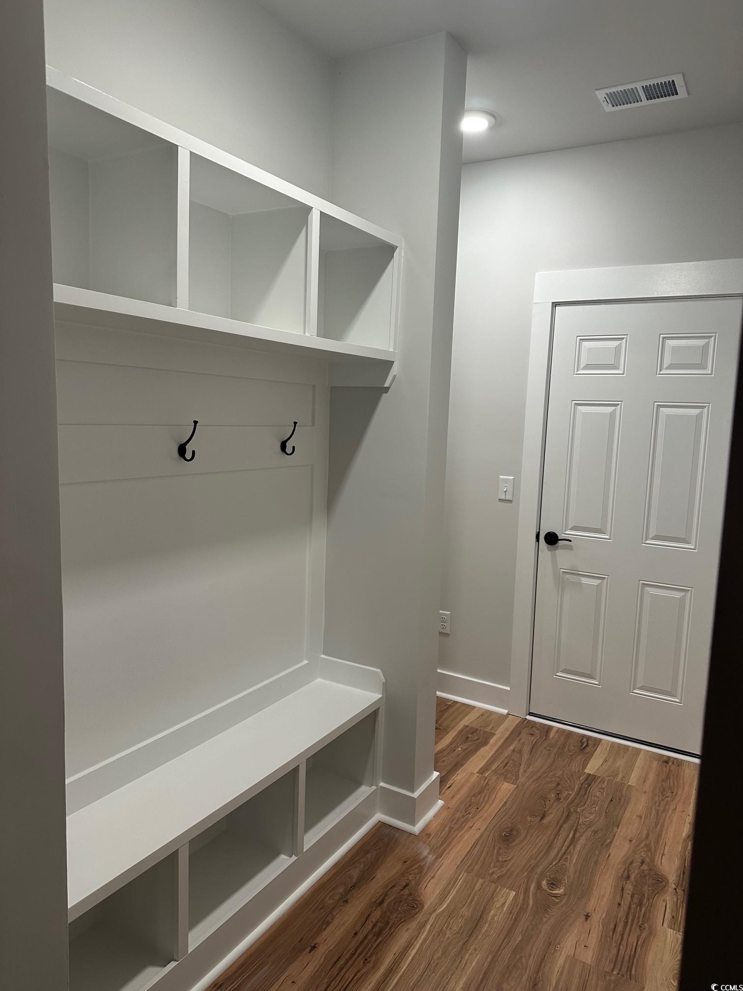 85 Northbrook Drive Murrells Inlet, SC 29576 - Photo 12 of 34 Mudroom with dark wood finished floors and baseboards