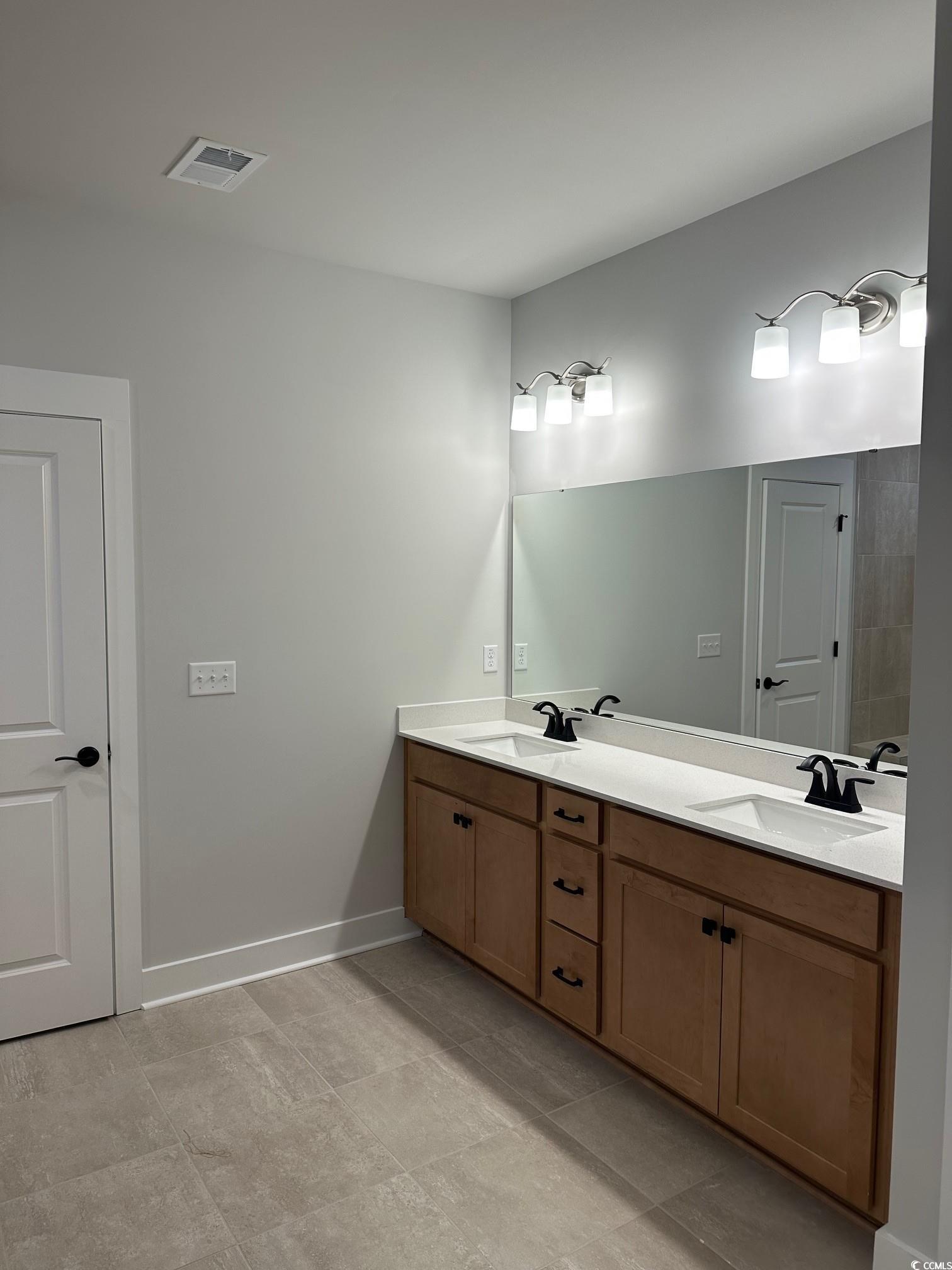 85 Northbrook Drive Murrells Inlet, SC 29576 - Photo 14 of 34 Bathroom featuring double vanity and baseboards