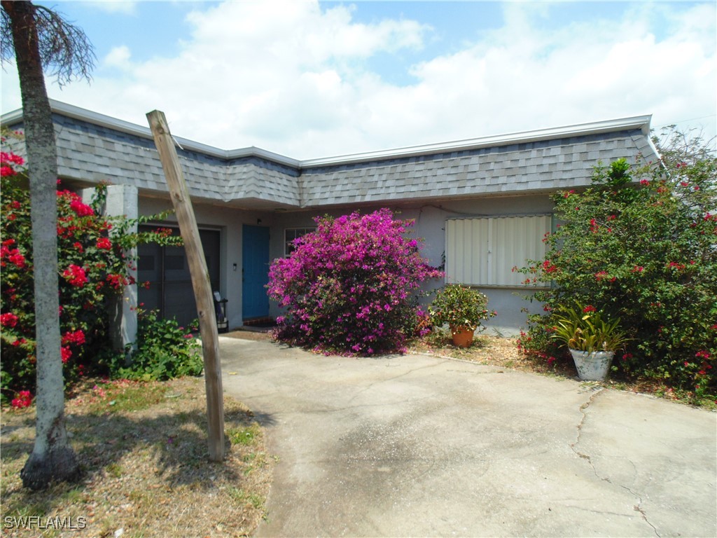 a front view of house with an outdoor space