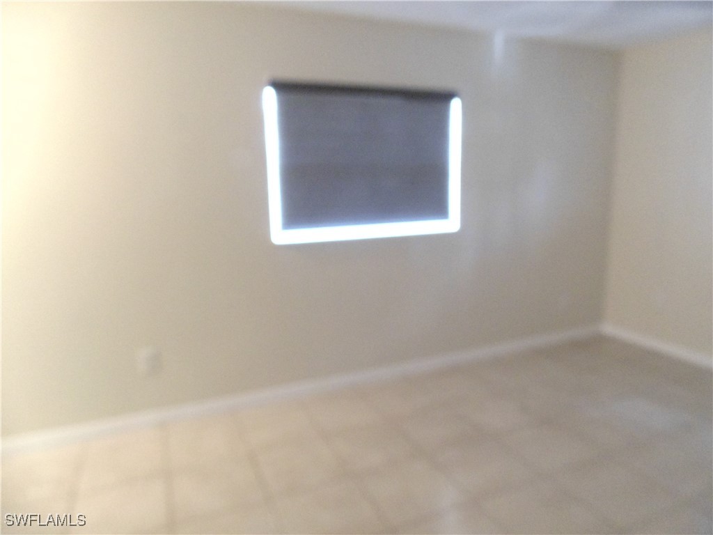 18215 Iris Road Fort Myers, FL 33967 - Photo 12 of 34 a bathroom with a window