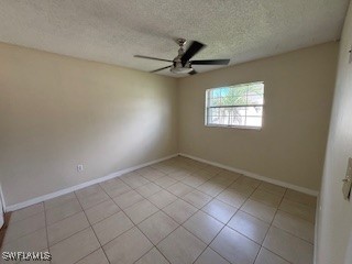 18215 Iris Road Fort Myers, FL 33967 - Photo 19 of 34 an empty room with windows and fan